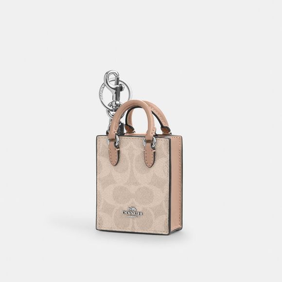 NWT Coach Outlet North/South Mini Tote Bag Charm In Signature Canvas - Picture 1 of 2